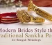 Gold-plated traditional sankha pola bangles featuring an intricate floral motif centerpiece on a white fabric background for a modern Bengali bride.